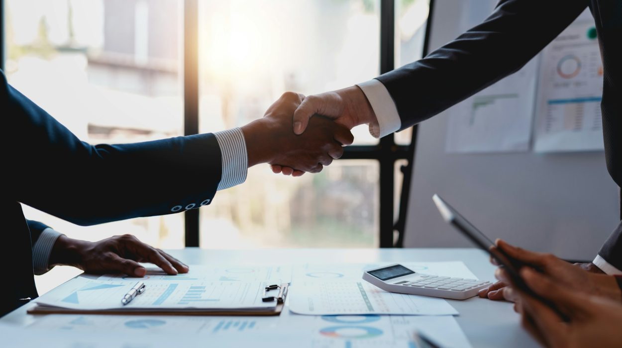 Business people shaking hands to congratulate success.