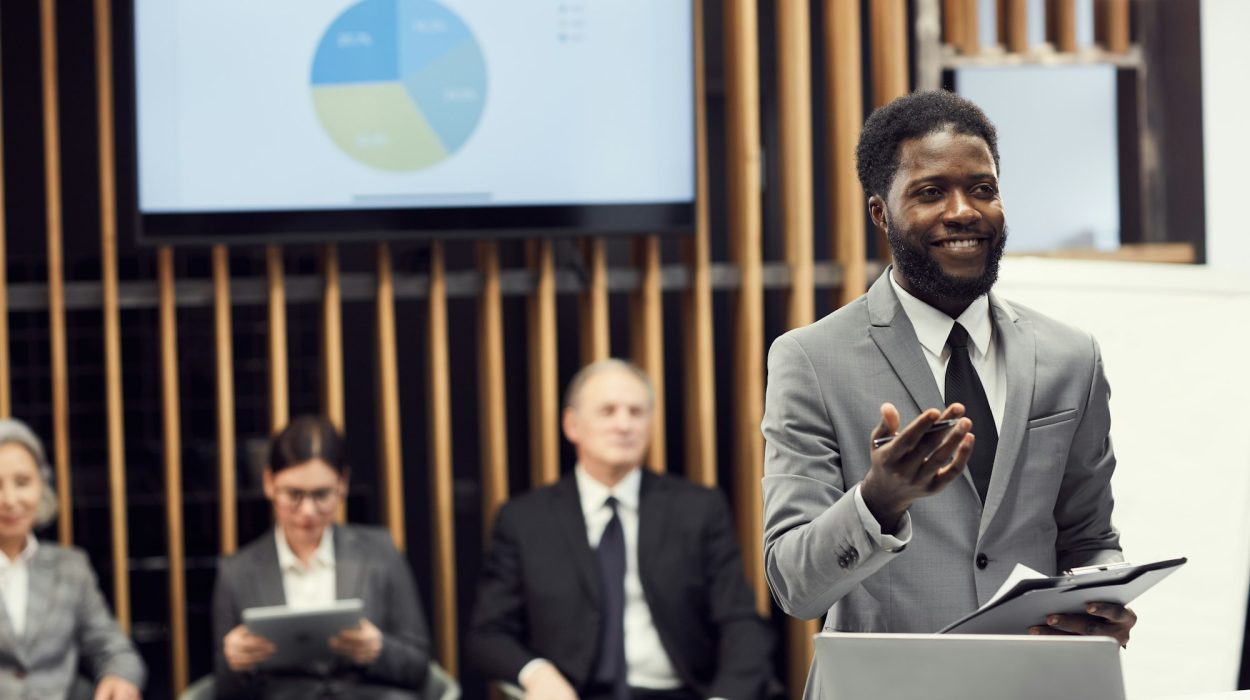 Cheerful black businessman sharing development strategy