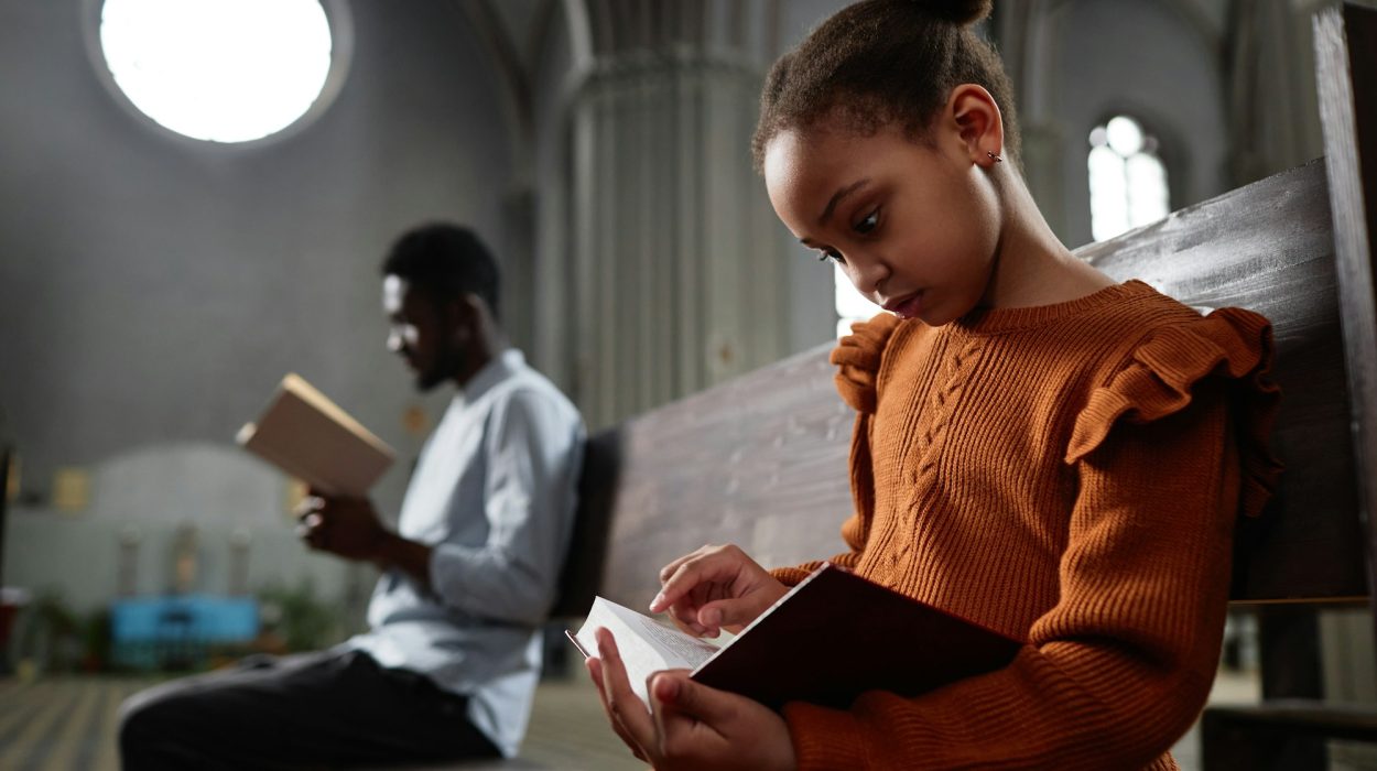 Little girl reading Bible in church