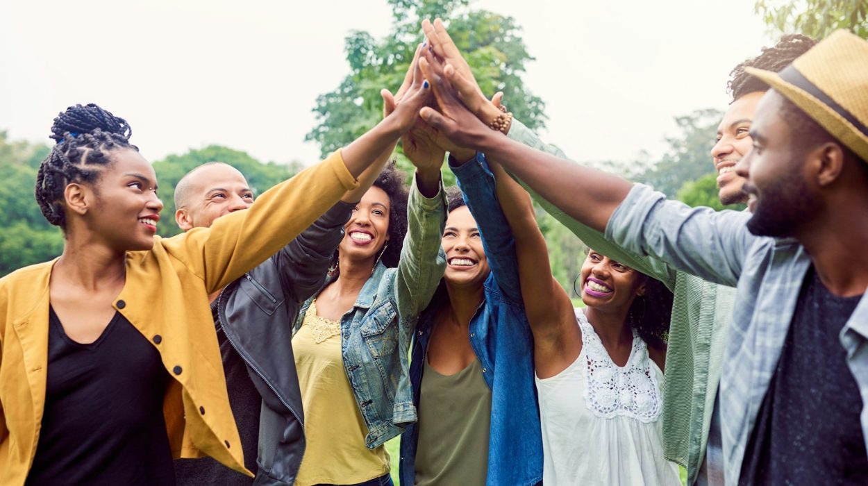 Were each others motivation. Shot of a group of friends reaching for a high five.